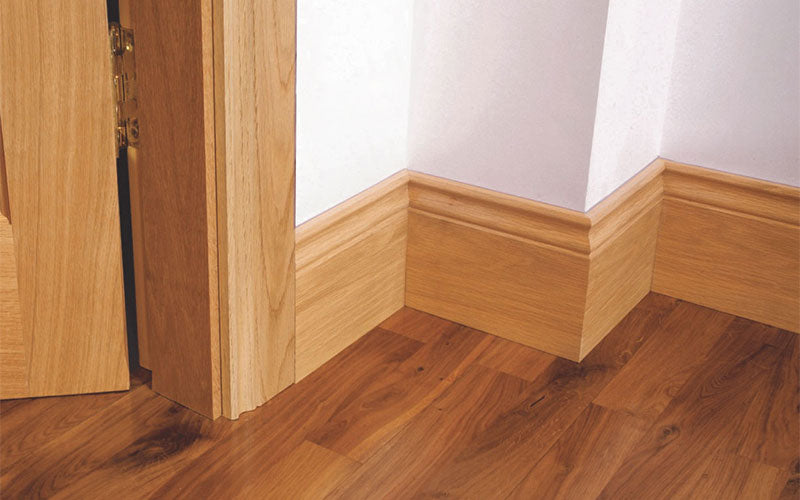 Pre-Varished Solid Oak Skirting Board, Architrave and Door Frame fitted to a wall, showcasing the stylish and high-quality products provided by DIY Timber Packs