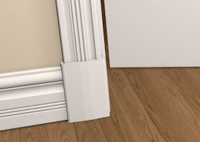 Pre-PReimed Wood Plinth Blocks shown fitted to the base of a wall, between architrave and skirting board